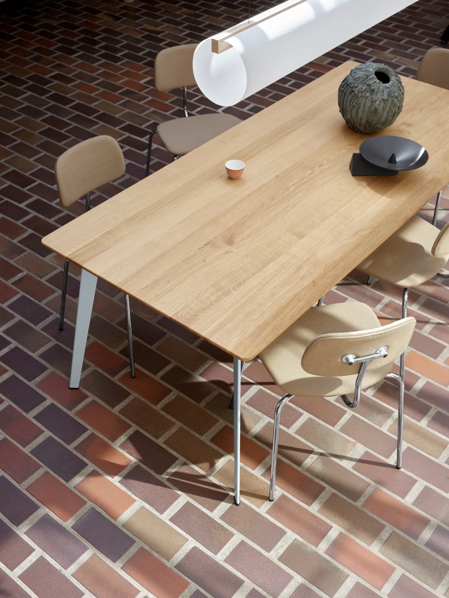 Detail view of Truffle and Azure textiles layered on Marée bar stools.