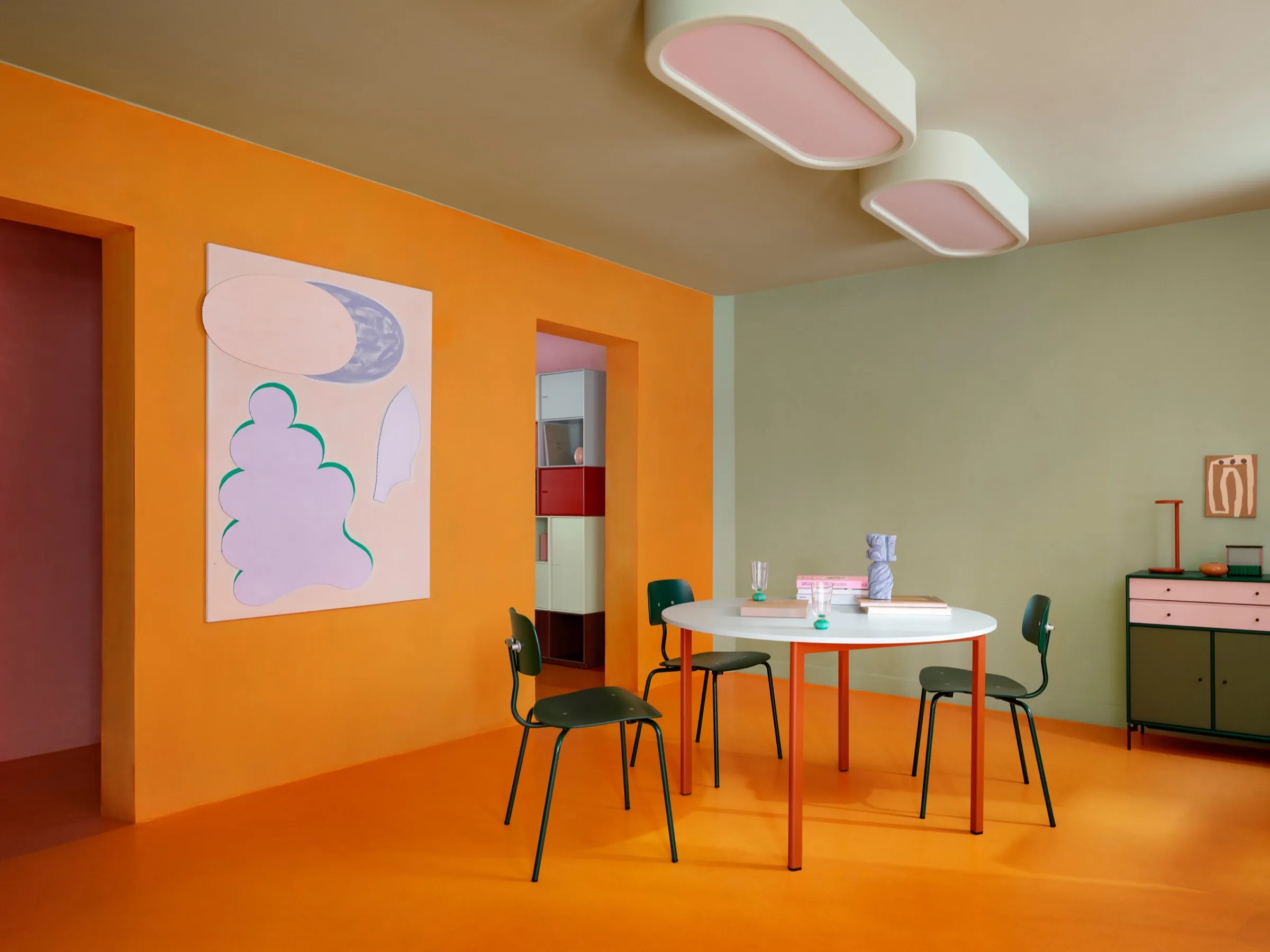 Color-rich shelving vignette styled with Hokkaido storage and Kevi seating.