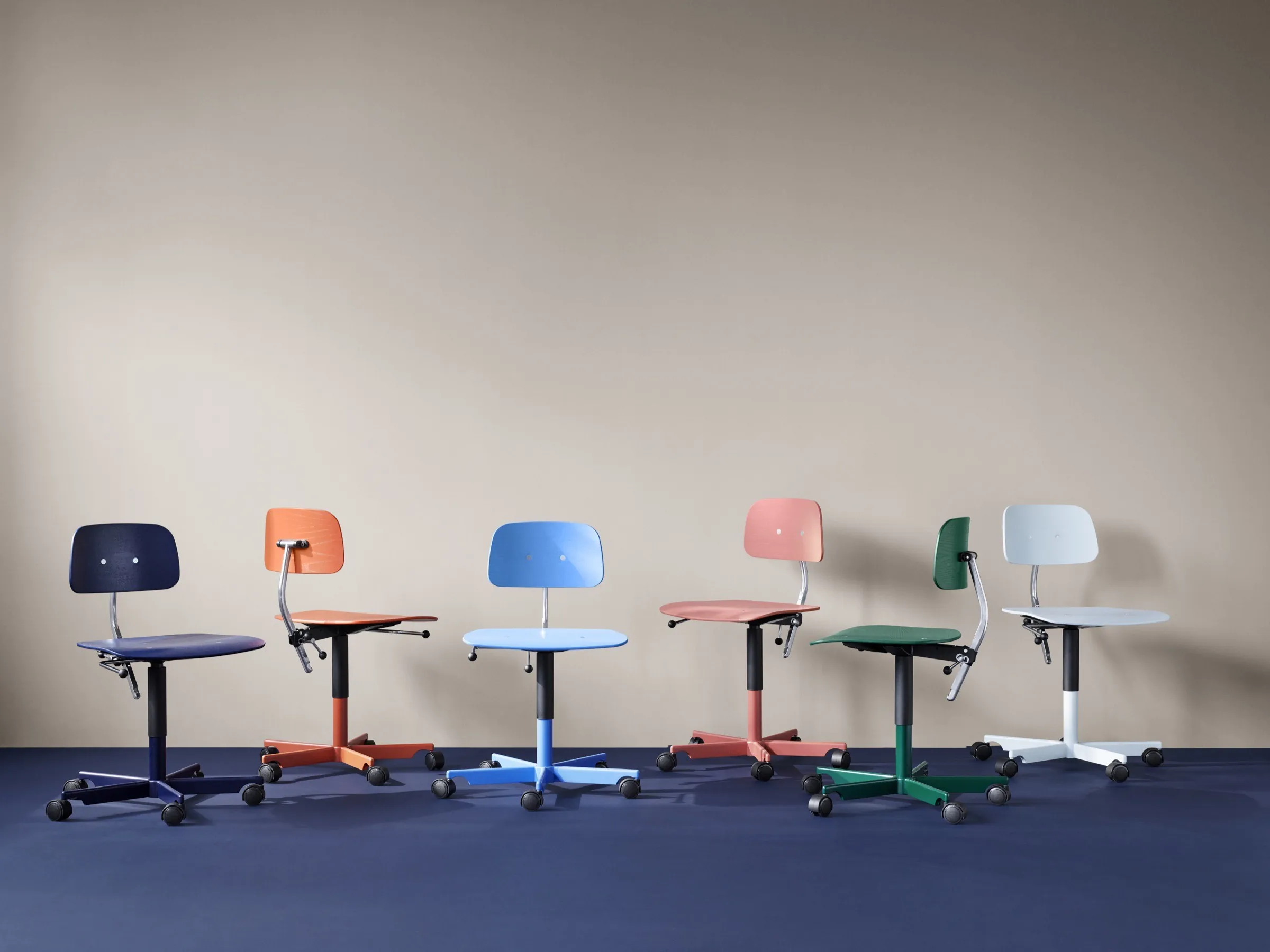 Office installation mixing Kevi chairs and Hokkaido storage in bold tones.